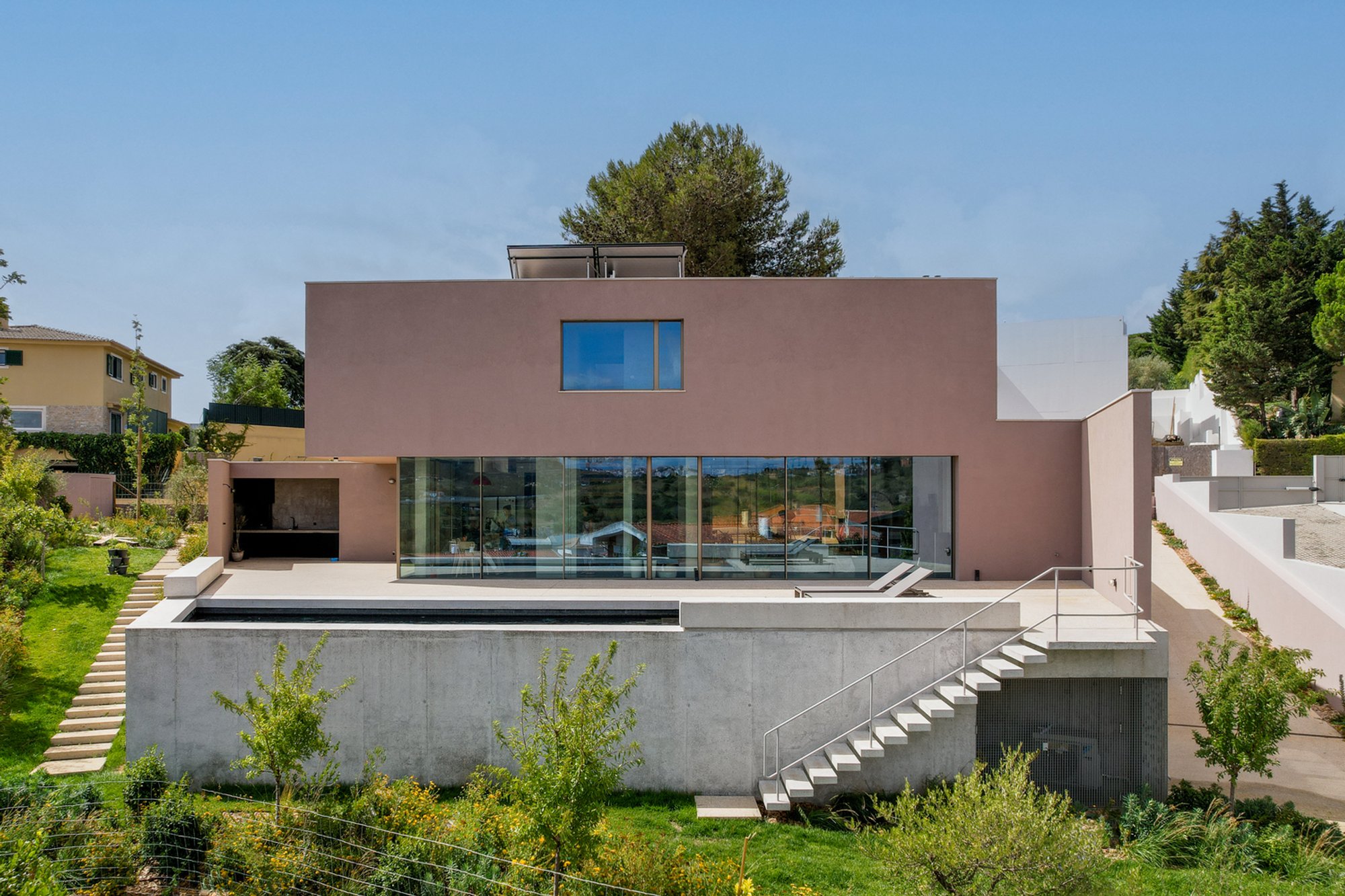 House in Caxias by João Caetano Arquitetura: A Modern Fusion of Privacy and Nature