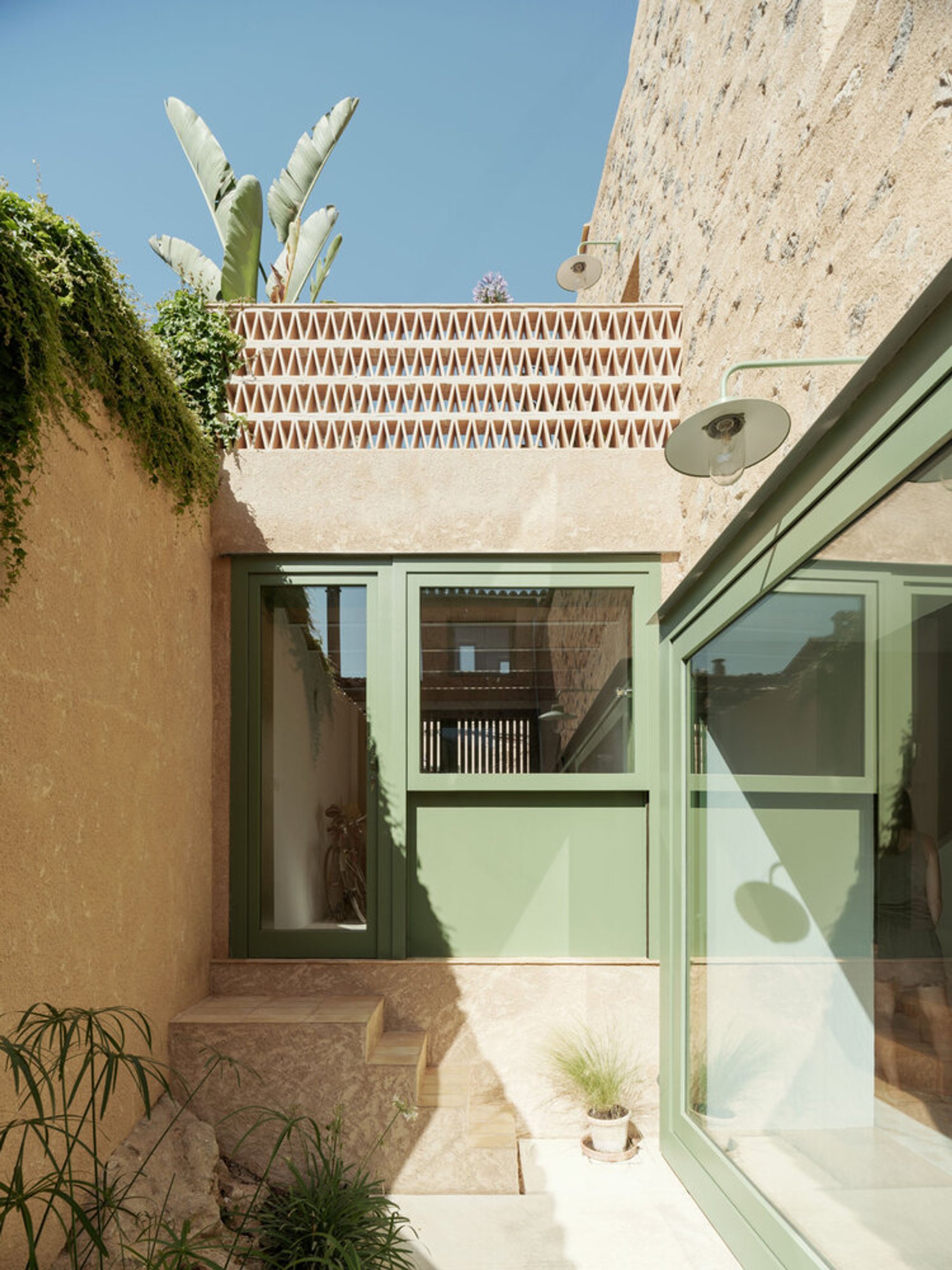Isla Architects Carve a Courtyard Into a Mallorcan Terrace House to Build the Mila House