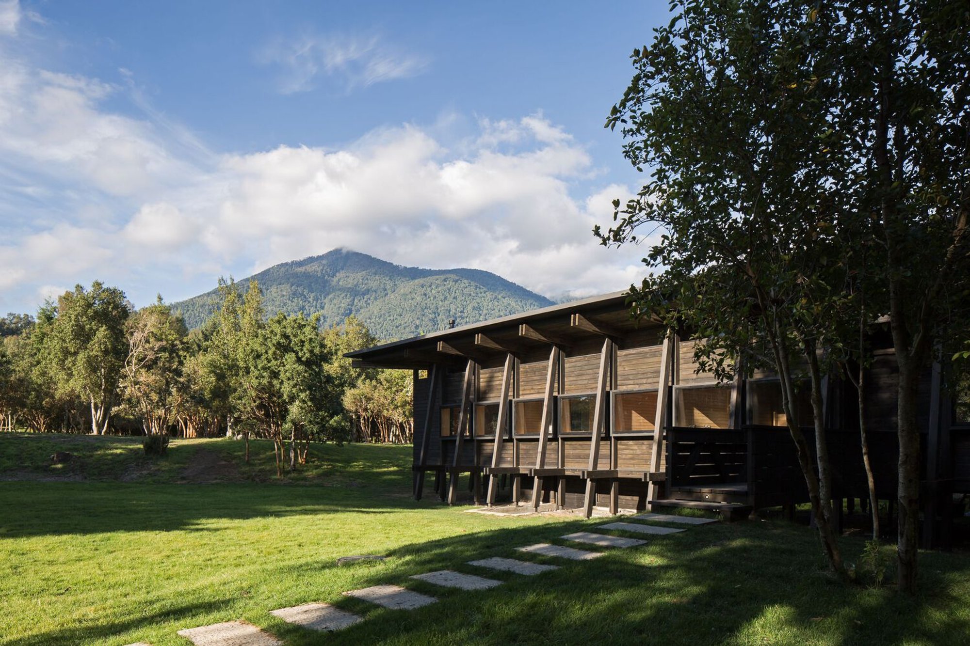 Hevia García and Poblete Build a Timber Exoskeleton Around a Rainwater Courtyard on Lake Ranco
