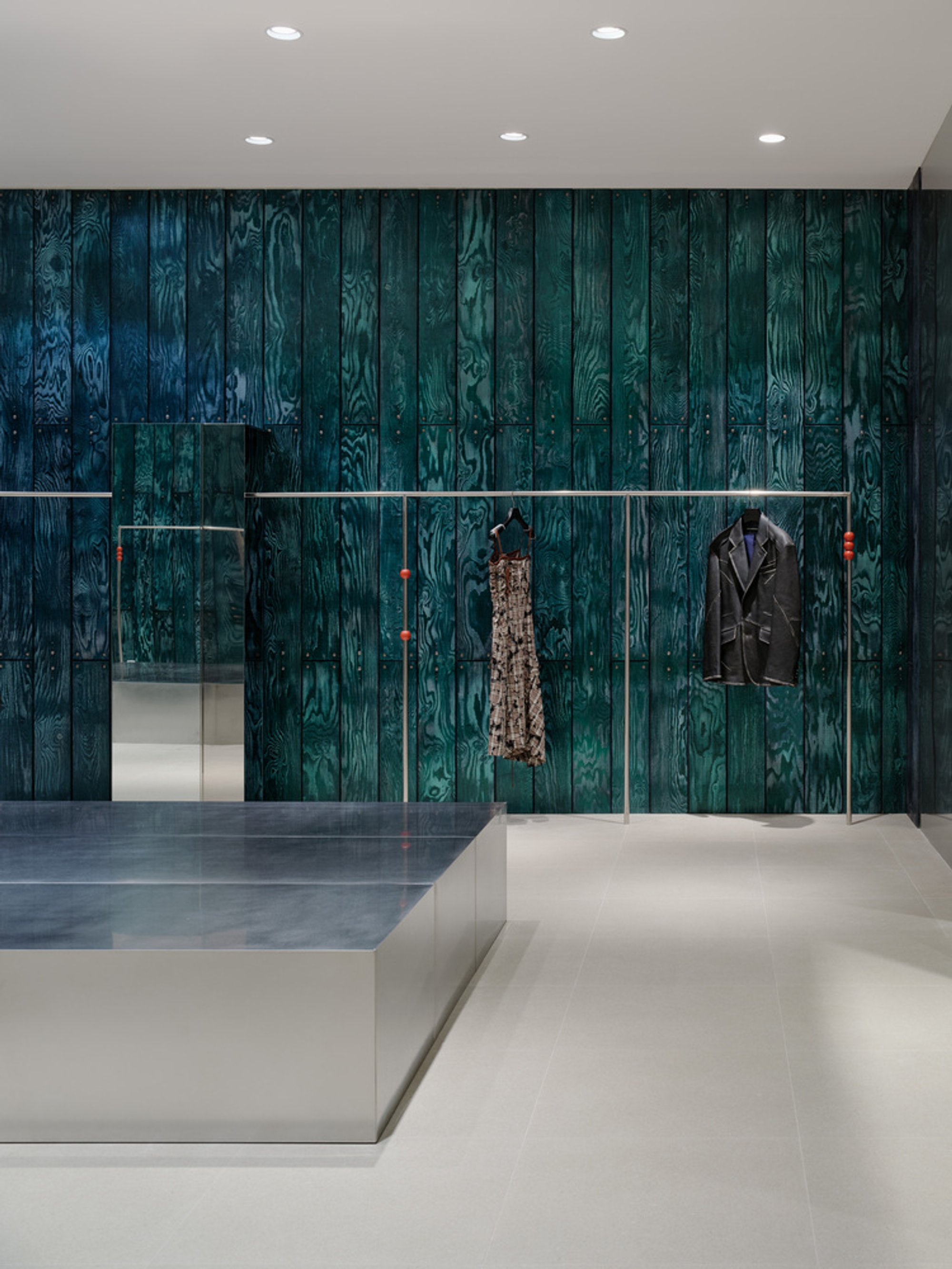 Studio Tama Wraps a Pangyo Fashion Store in Chameleon Wood and Chrome