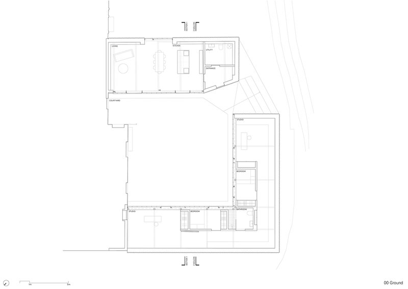 Ground floor plan drawing showing two connected volumes forming an L-shaped courtyard arrangement