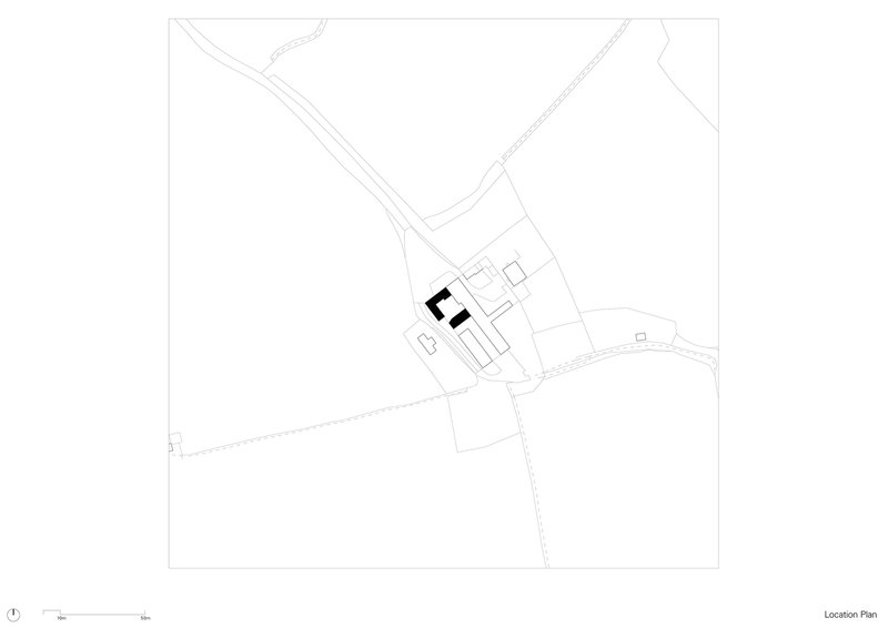 Site plan drawing showing building cluster positioned between converging roadways and landscape contours