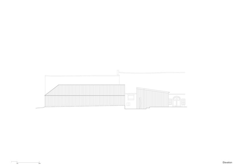 Elevation drawing displaying a sloped-roof volume connecting to a smaller gabled element with arched opening