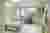 This architectural image showcases a modern hospital room designed for patient comfort and efficient