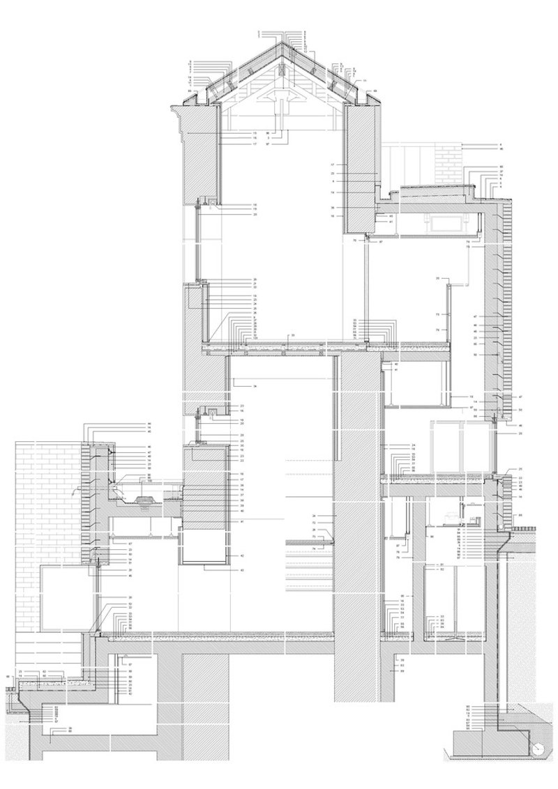 Detailed section drawing revealing gabled roof structure, stacked rooms, and material transitions across three levels