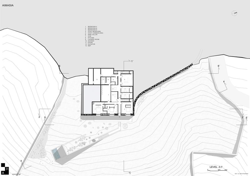 Floor plan drawing showing rectangular volumes with interior rooms arranged around a central courtyard on sloping site