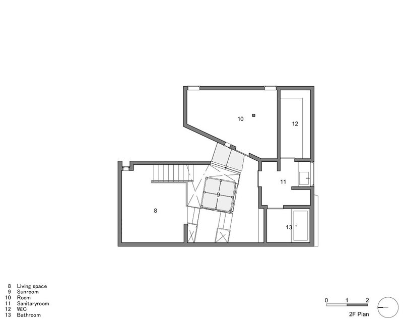 Second floor plan drawing showing living space, sunroom and central stairwell with angled geometry