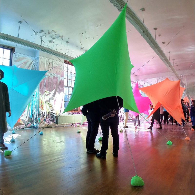 Visitors engage with Color Constellation, a vibrant, interactive installation by Virginia Melnyk that transforms space with dynamic forms