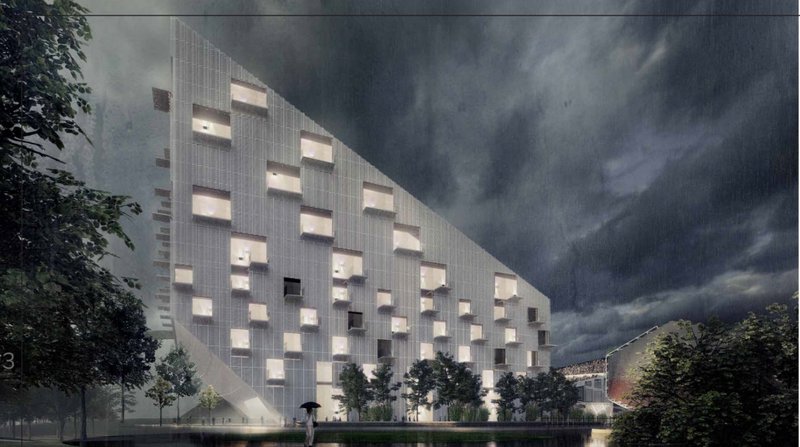 Nighttime Atmosphere – The striking facade of the stadium's adjacent building illuminated under dramatic skies.