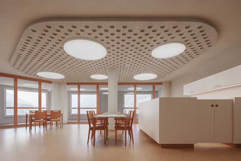 Dining space with perforated ceiling panel and circular skylights over timber tables and chairs