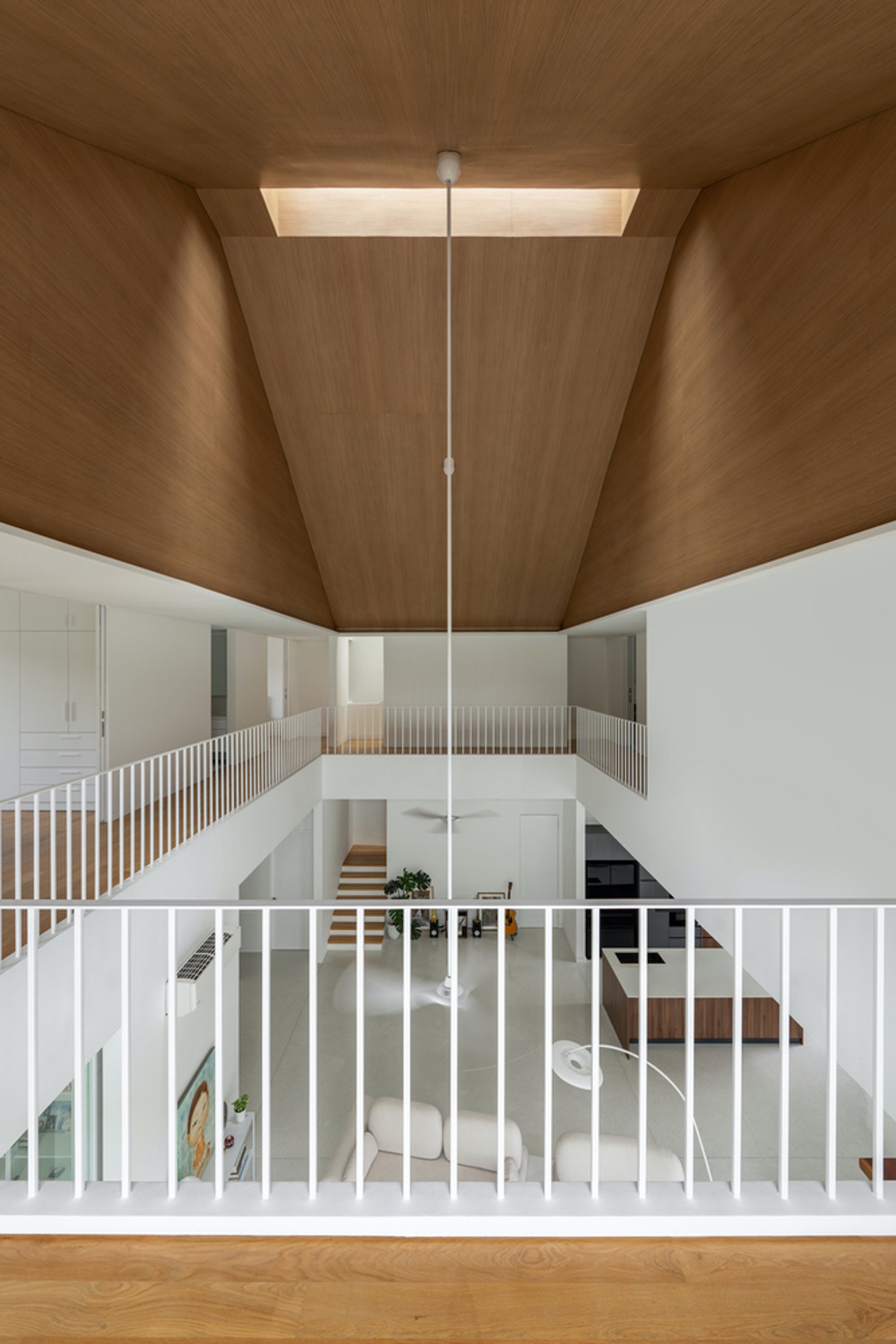 Fabian Tan Architect Builds a Three-Story Family House Around a Skylit Timber Void in Kuala Lumpur