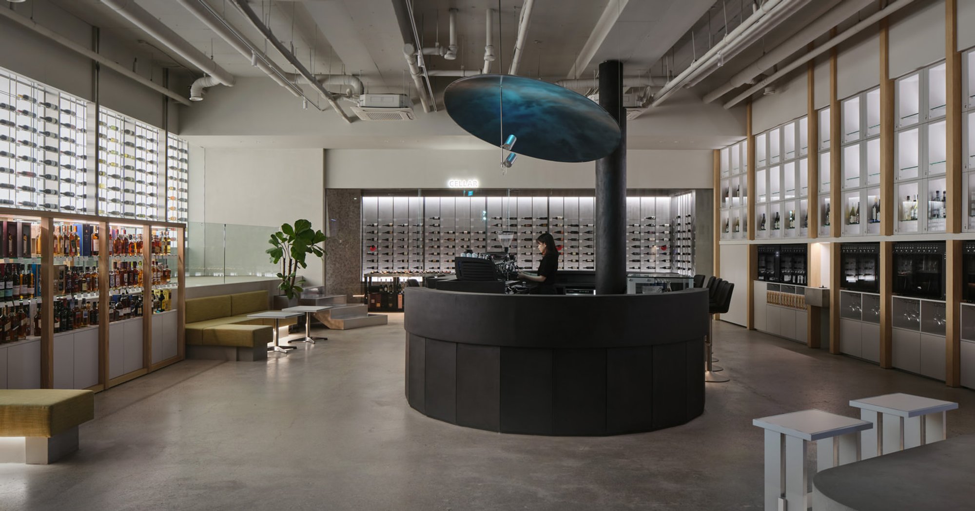 Studio Prepro Wraps a Circular Bar in Black Concrete to Anchor Seoul's Winenara Wine Hub