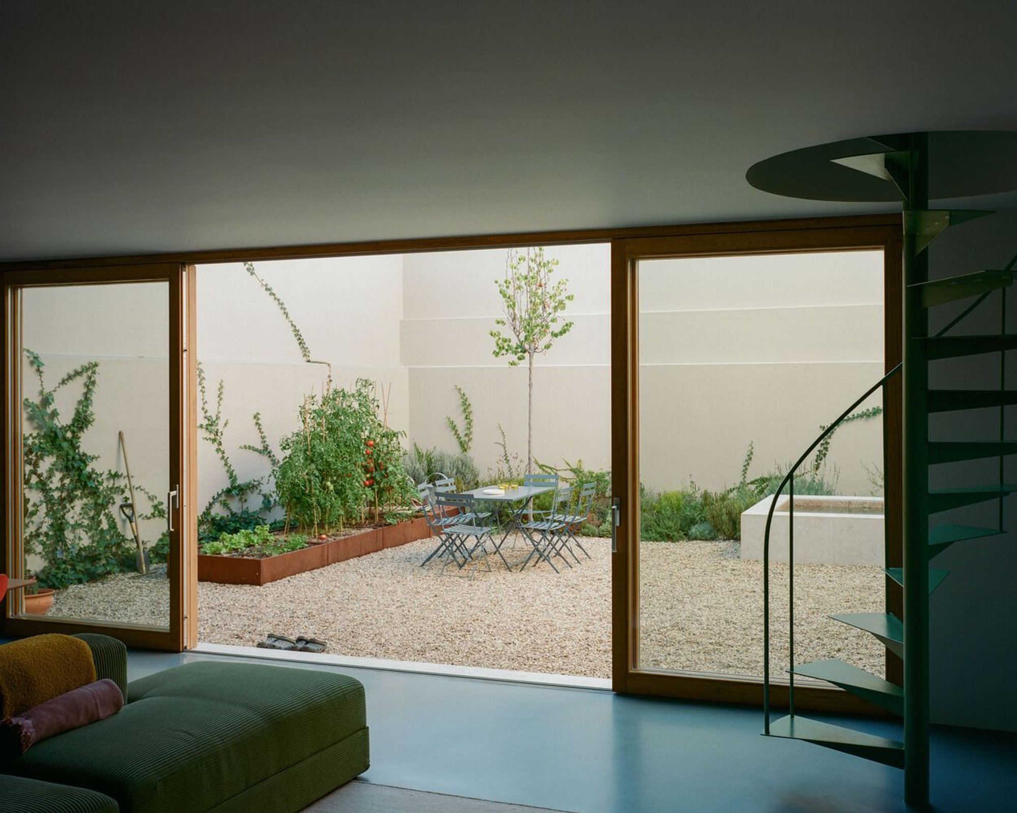 Atelier José Andrade Rocha Cracks Open a Lisbon Townhouse to Let the Garden In