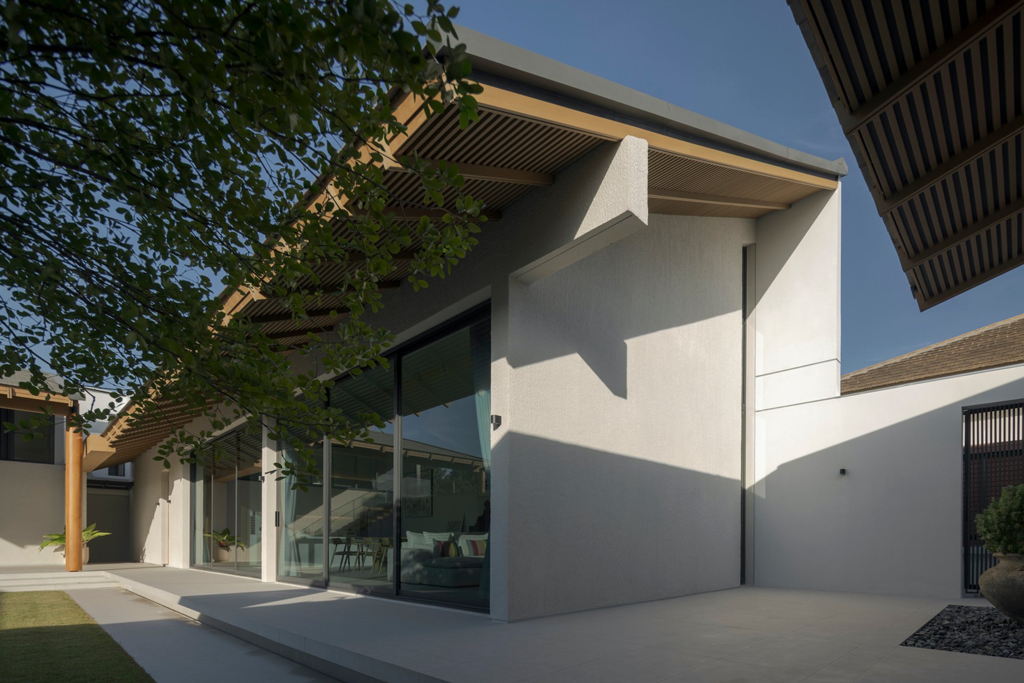 Baan Tectonix House: A Thoughtful Approach to L-Shaped House Design by I Like Design Studio