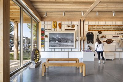 This architectural image showcases a modern museum interior with a focus on natural light and minima