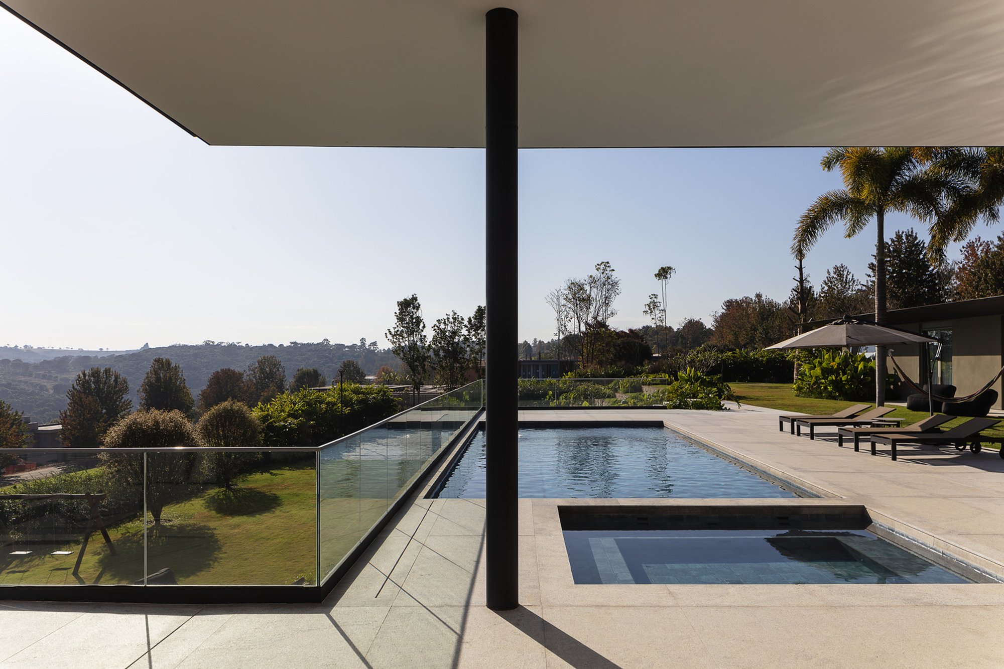 Gálvez & Márton Drape a Metal Roof Over the Brazilian Hillside to Frame the Sunset