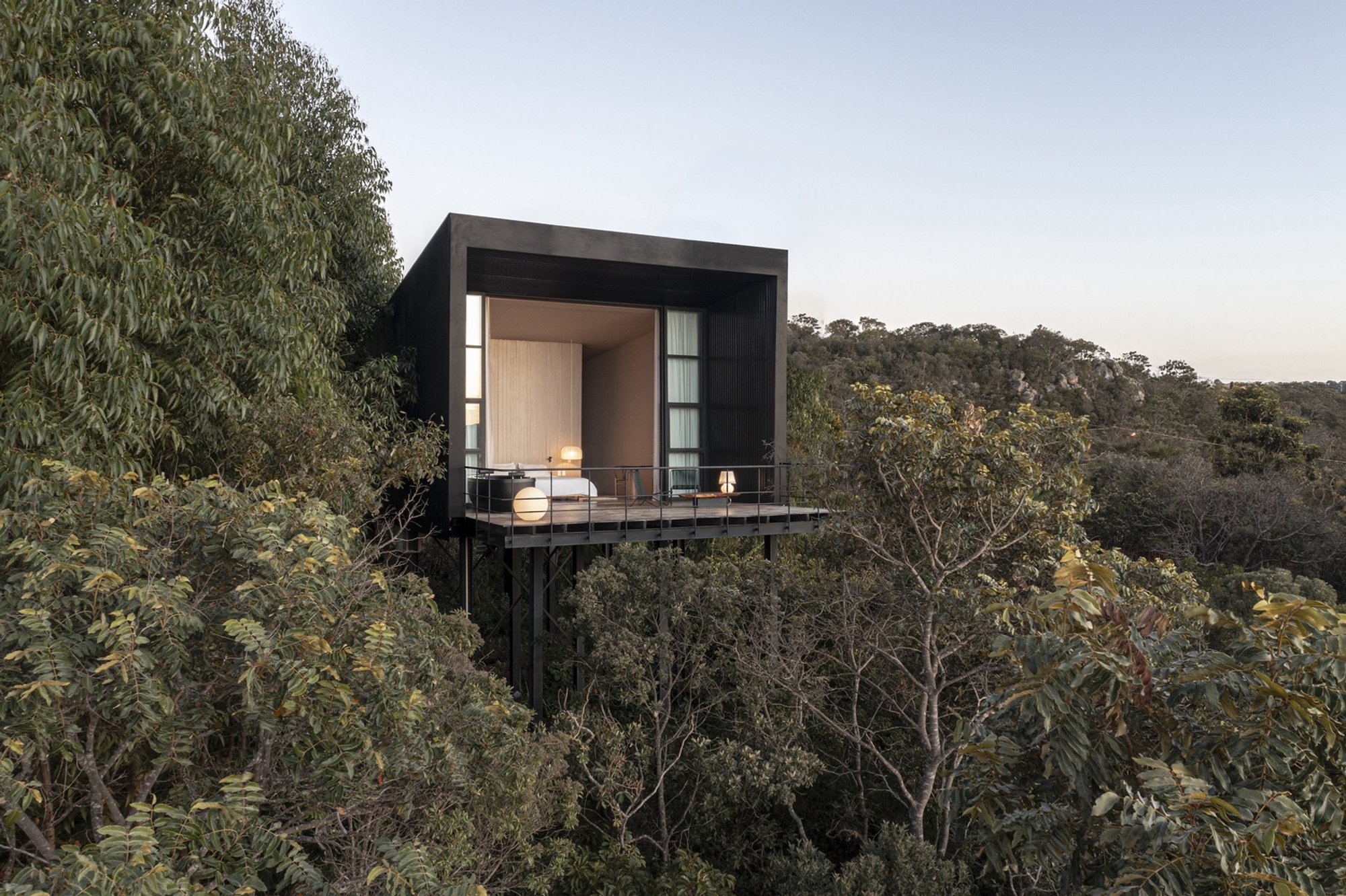 Alan Chu Lifts a Trapezoidal Monocle Above Brazil's Cerrado to Frame the Sunrise