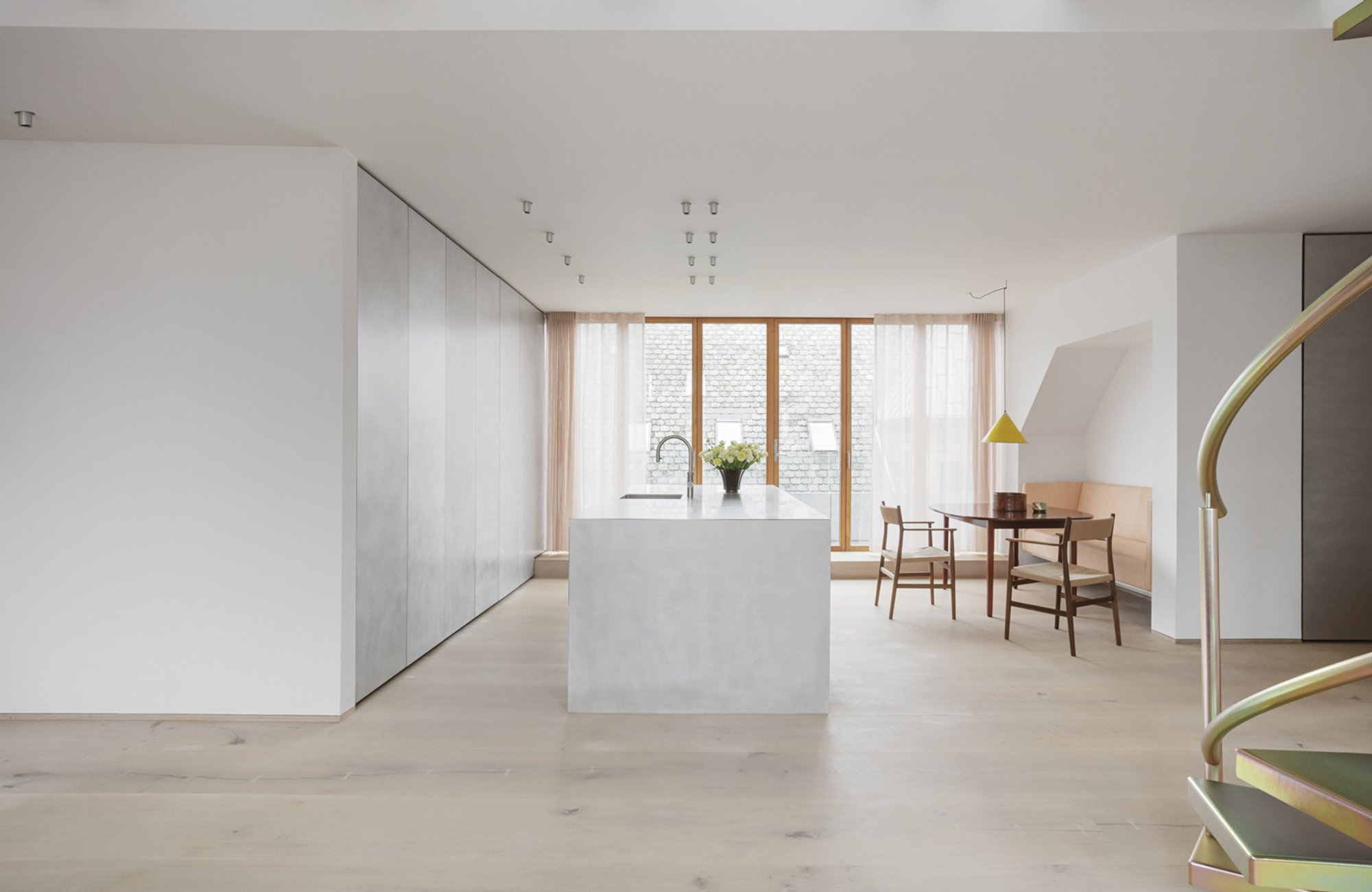 Studio David Thulstrup Carves a Double-Height Living Space from an 1890s Copenhagen Rooftop
