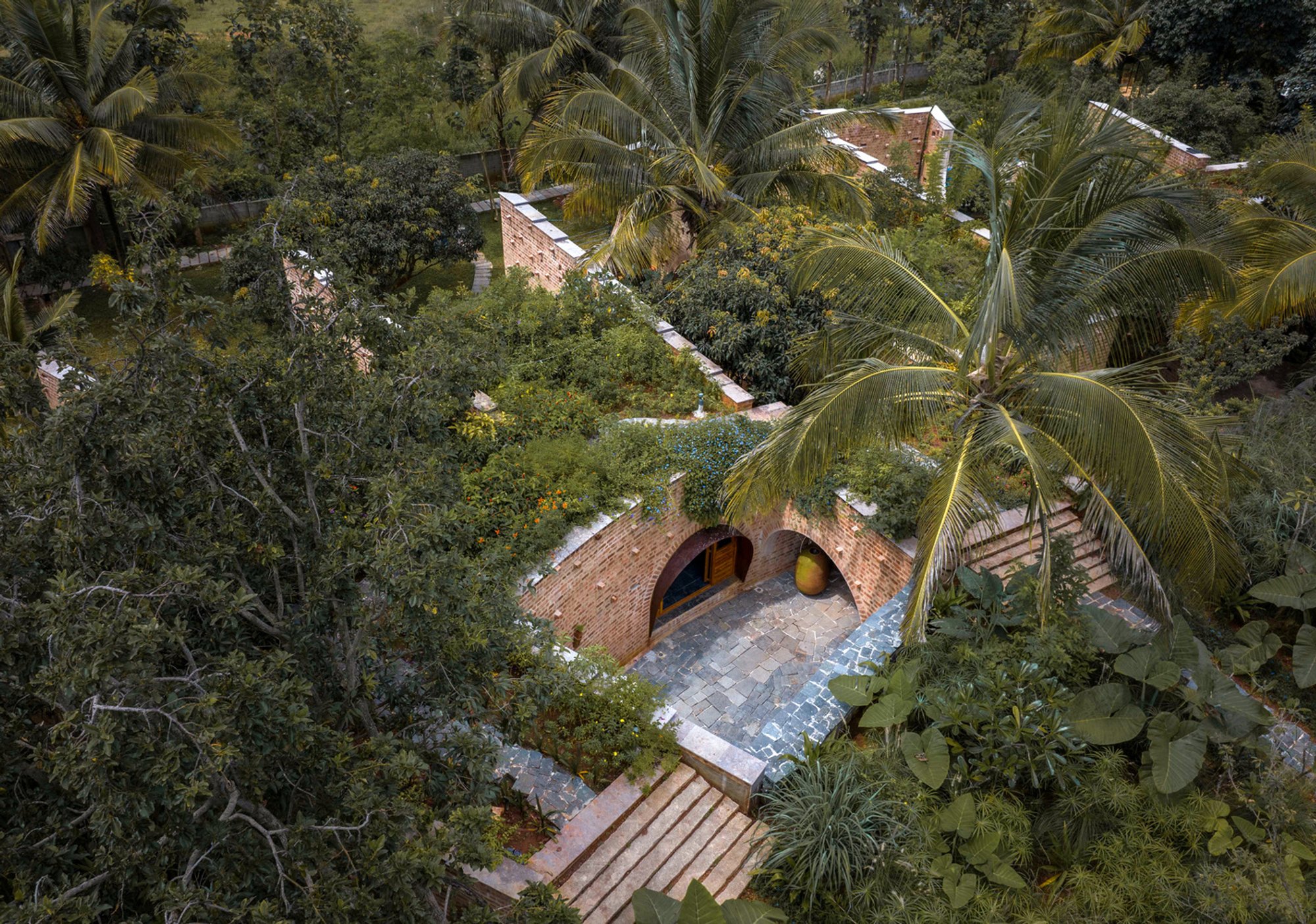 Subterranean Ruins by A Threshold: A Sustainable Retreat Blending with Nature