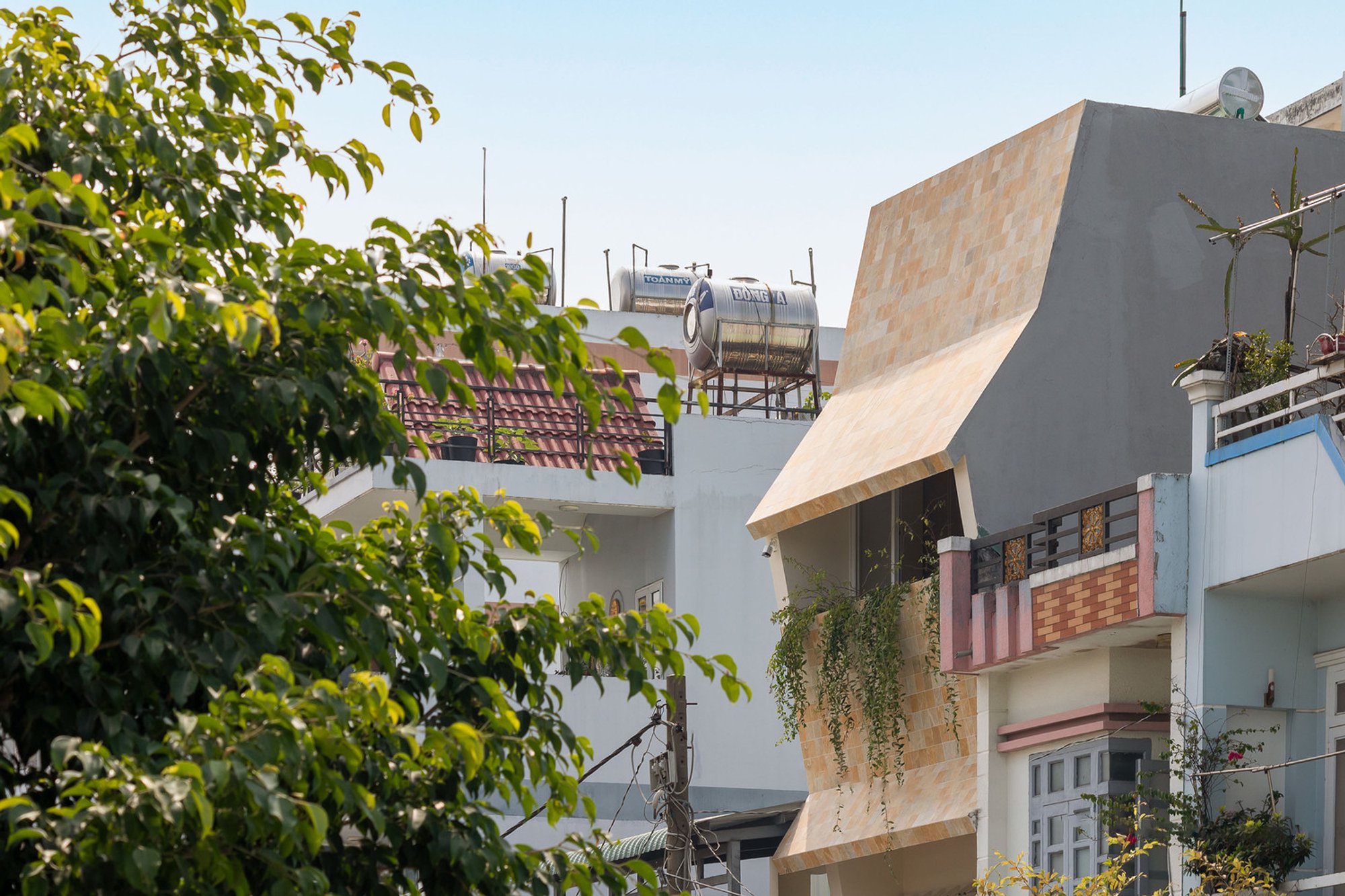 Tropical Minimalist House: Origami House by DA VÀNG Studio