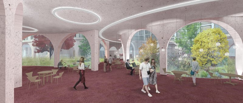 Inviting communal area with views into the lush courtyard, blending nature and coworking culture.