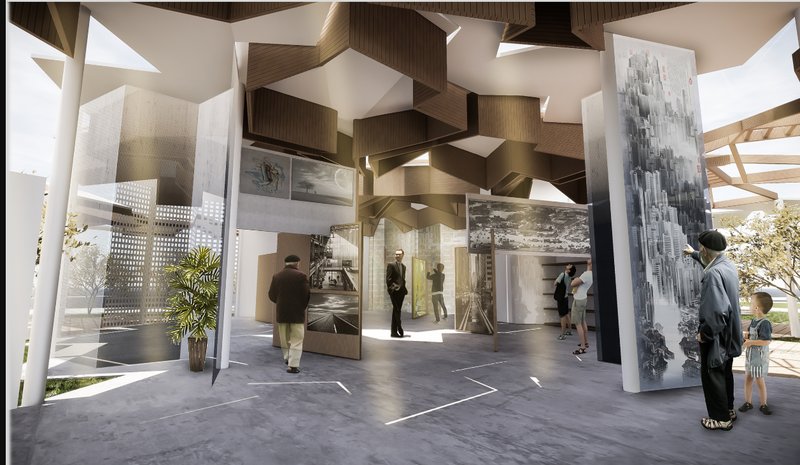 Interior gallery space with faceted timber ceiling panels and large photographic displays on standing walls