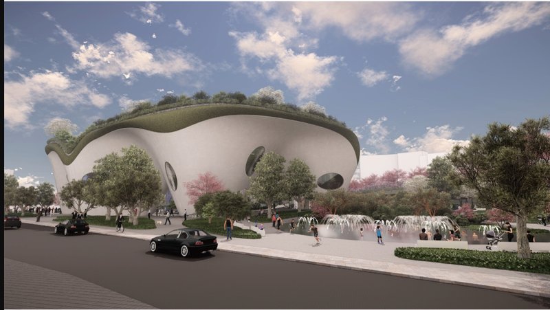 A tree-lined plaza with fountains and shaded pathways softens the transition between public and sacred.