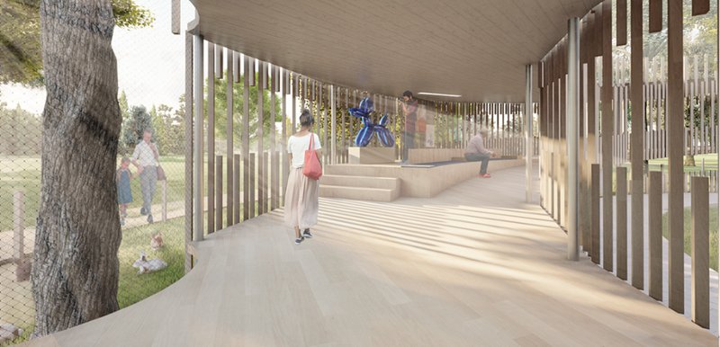 A gently sloped ramp doubles as an exhibit path, encouraging exploration and passive interaction with art and nature.