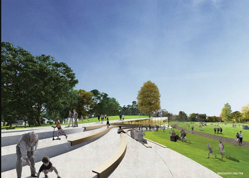 A terraced amphitheater blends into the landscape, encouraging intergenerational interaction and outdoor gathering.