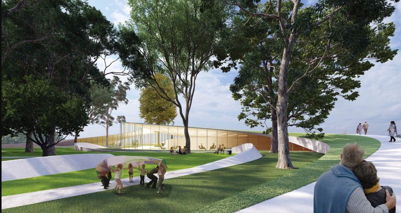 Gentle green slopes curve around the building, inviting all ages to engage with nature and each other.