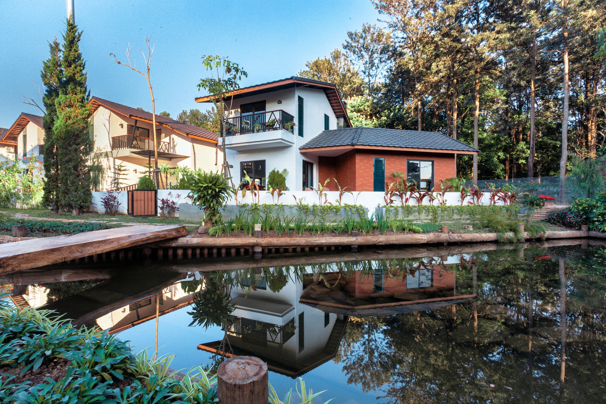1+1>2 Architects Weave a Village of 24 Gabled Houses into Myanmar's Highland Oak Forest