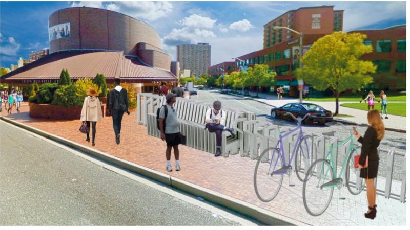 Bloc enhancing pedestrian comfort outside civic and cultural buildings.