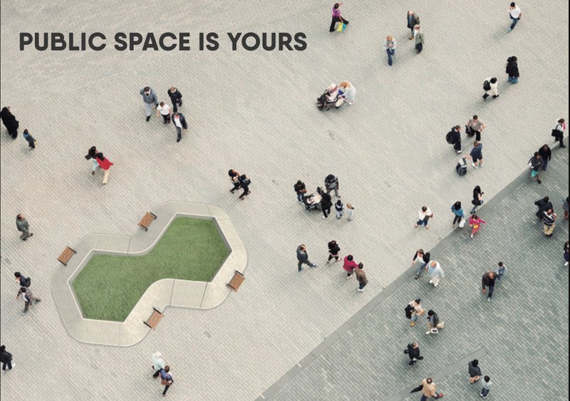 Aerial view of the cloverleaf plaza with green turf insert surrounded by pedestrians on pavers