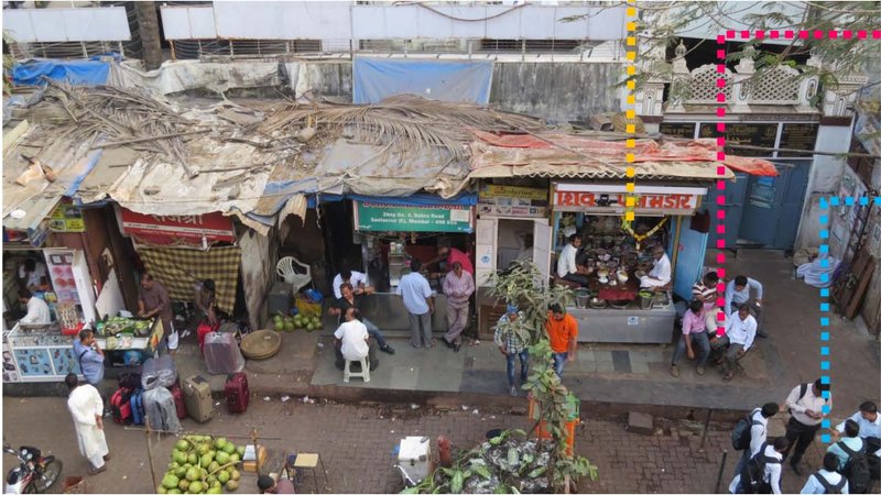 Local vendors and pedestrians demonstrate the social and economic life unfolding on footpaths.