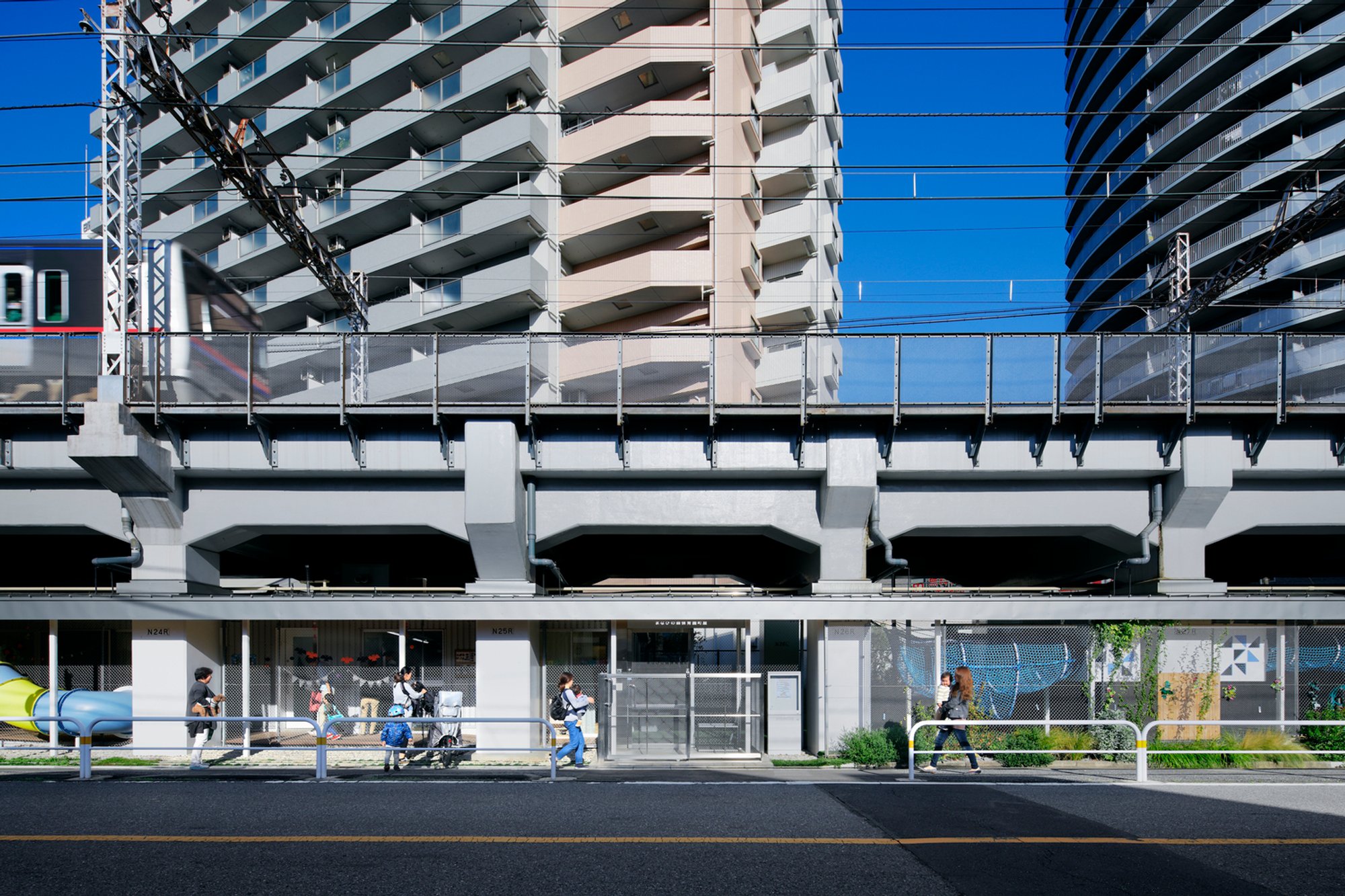 Nursery School Under Elevated Railway in Machiya