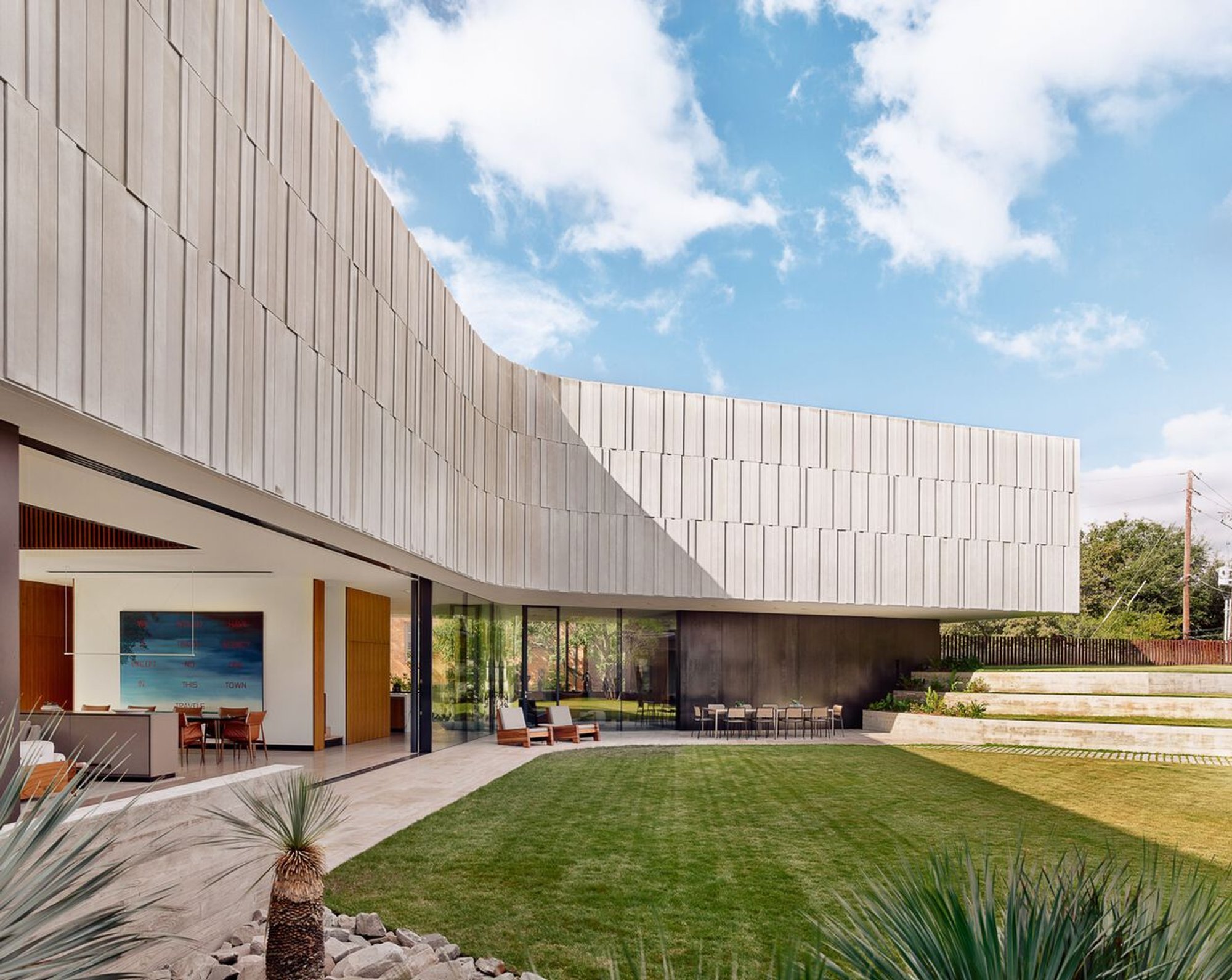 Highland Park Residence by Alterstudio Architecture: A Modern Limestone Home for Art and Living