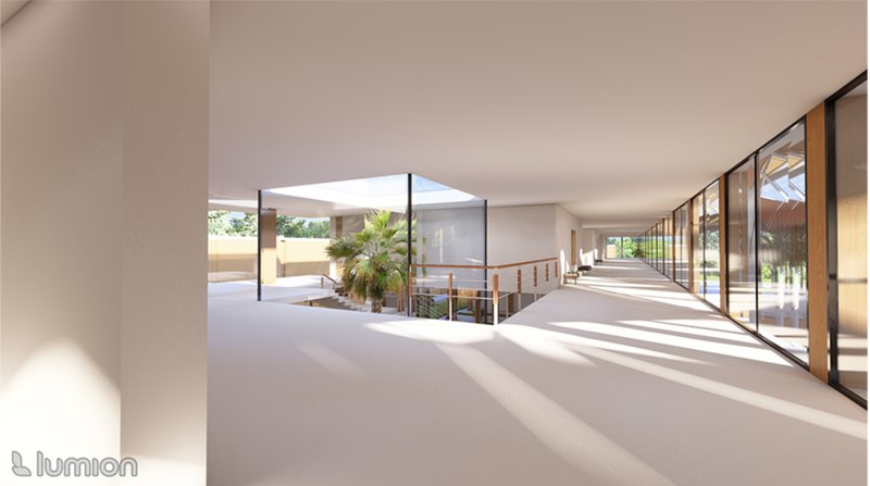 Natural light filters through wide openings, illuminating open circulation spaces and fostering a calm, contemplative ambiance.