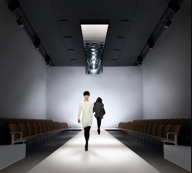 LuxOre illuminating a fashion runway — where geometry and movement amplify visual rhythm and elegance.