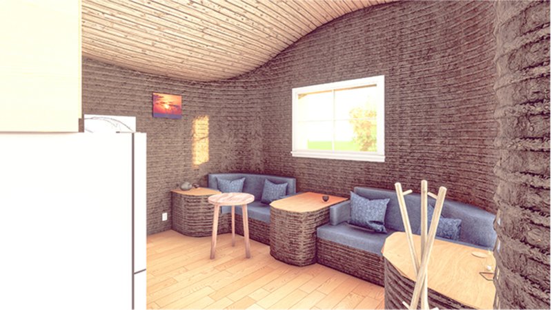 Living area with horizontal rammed earth walls, window framing green landscape and woven seating alcoves
