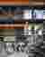 This architectural image showcases the interior of a modern industrial facility. The space features 
