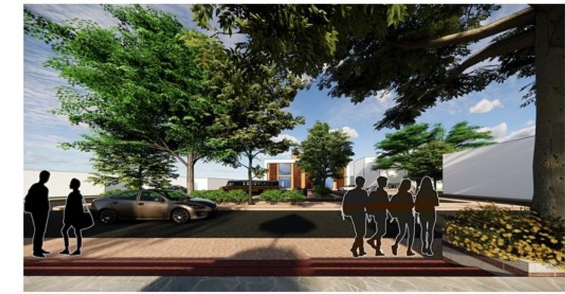 A welcoming threshold connecting the community to the revitalized mill complex, framed by greenery and restored brickwork.