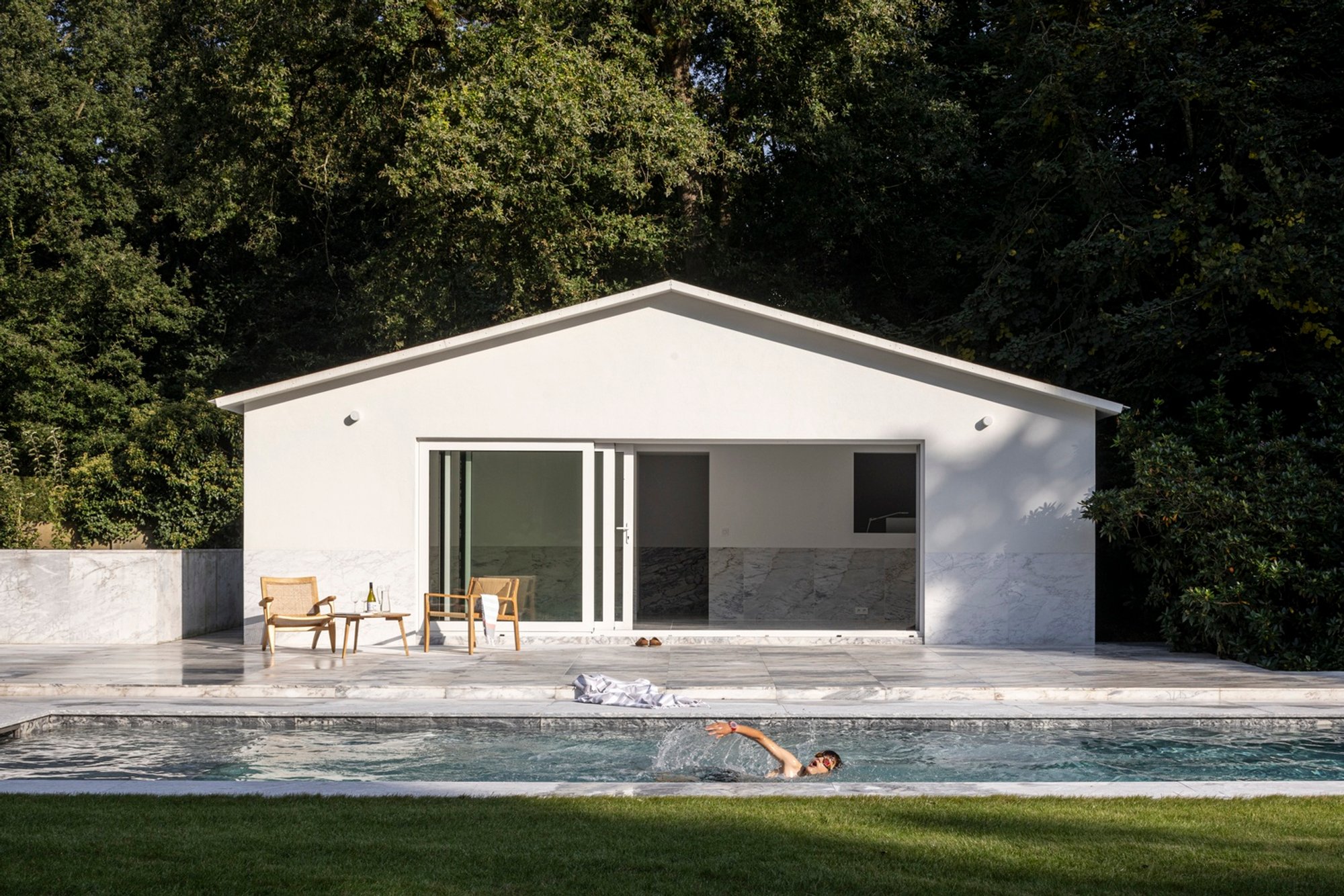 Garden No. 2 House in Limburg: Marble-Clad Garden Pavilion and Pool by Camarim Arquitectos