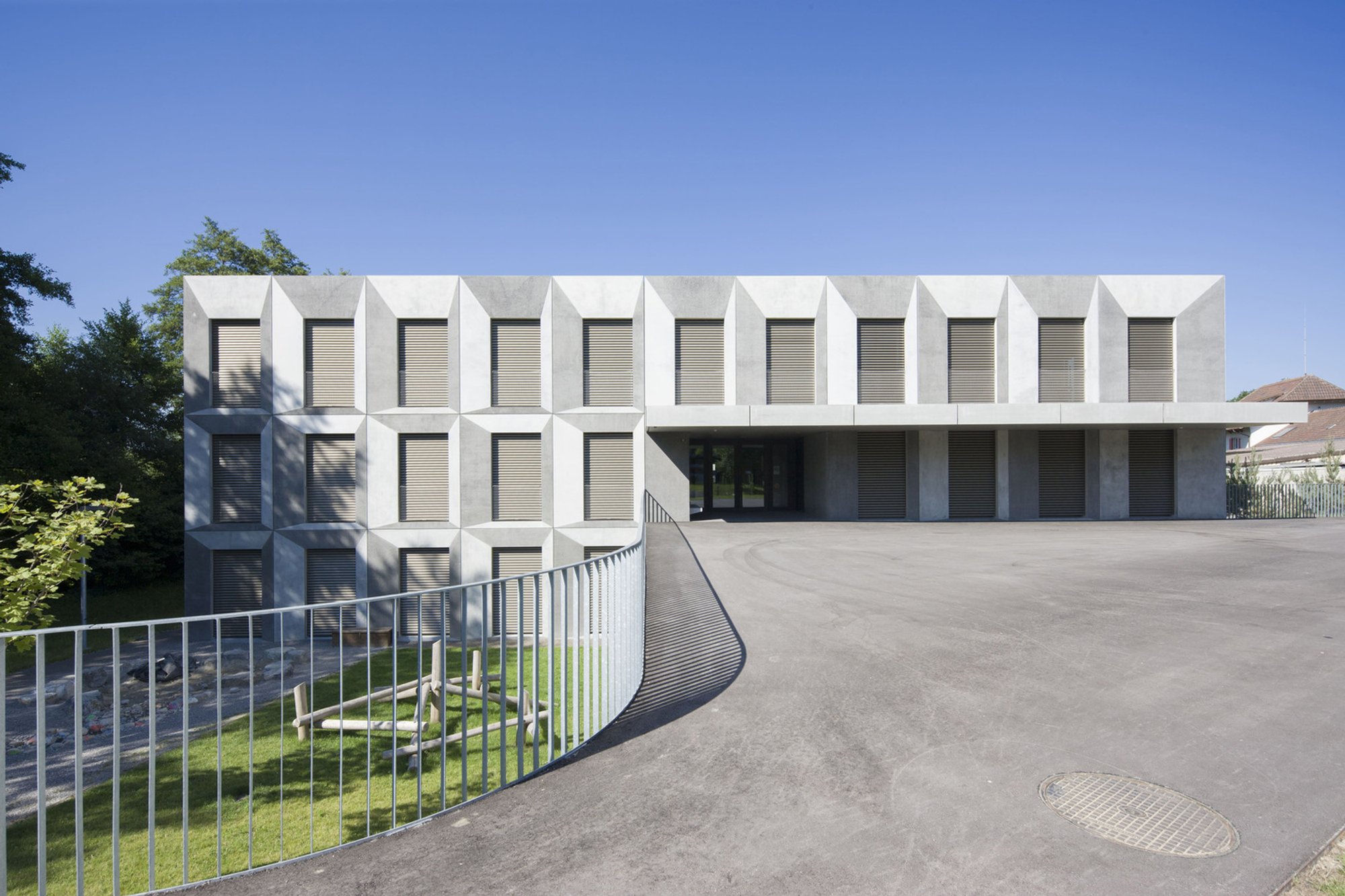 Grentschel School Extension by ahaa: A Harmonious Educational Landscape in Lyss, Switzerland