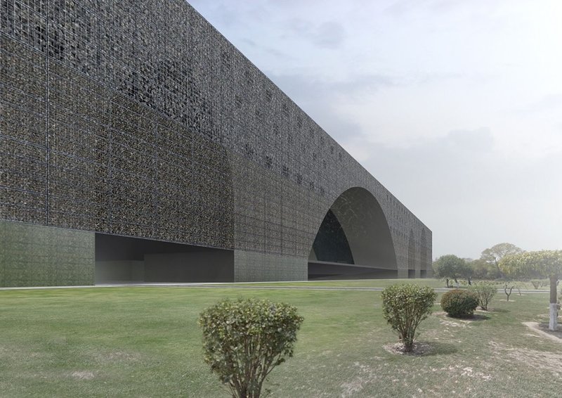 The textured gabion façade captures sunlight and wind, echoing the rhythm of traditional Mughal symmetry through modern materiality.