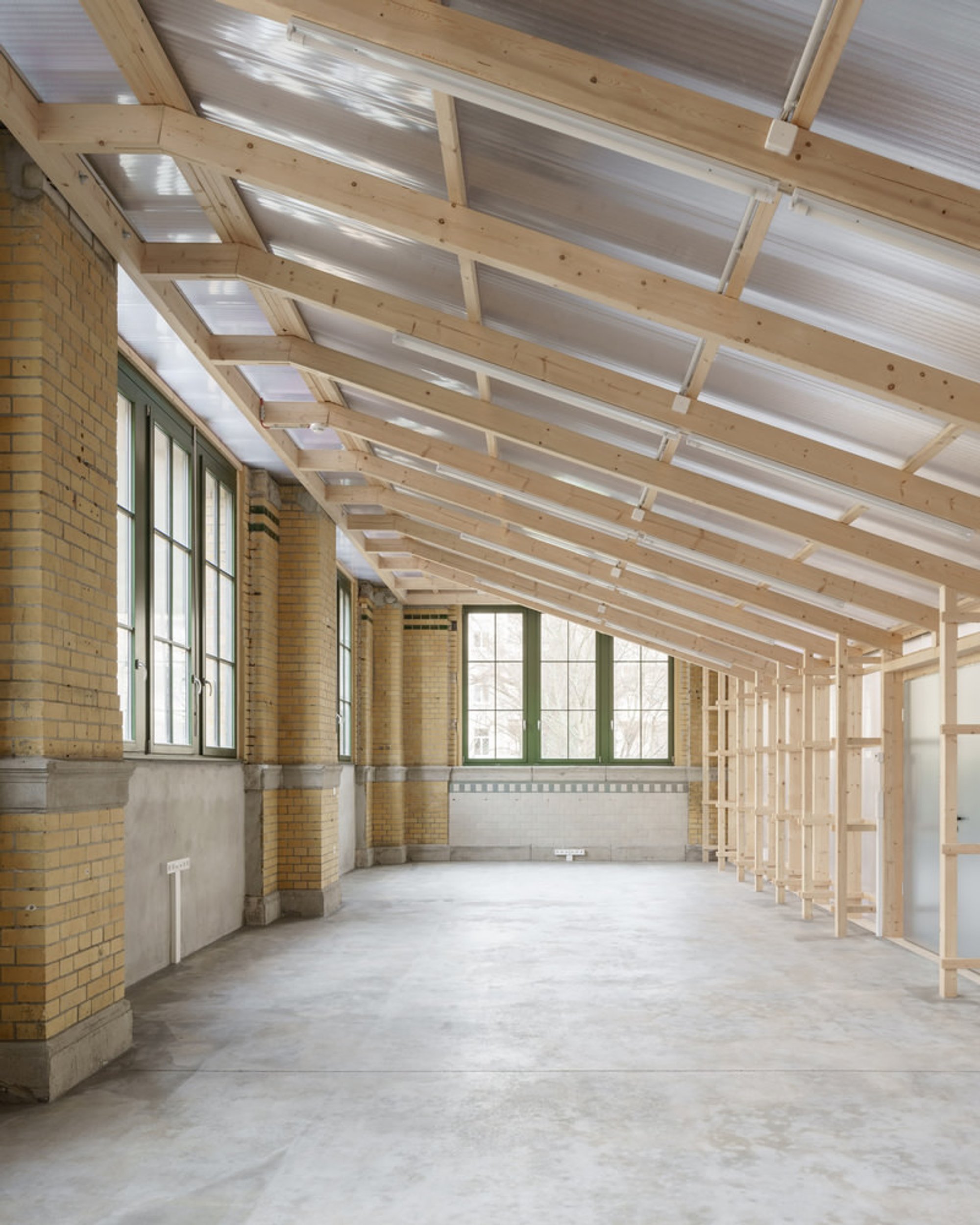 KO/OK Architektur Slots Two Translucent Timber Boxes into a 1910 Leipzig Machinery Hall for €80,000