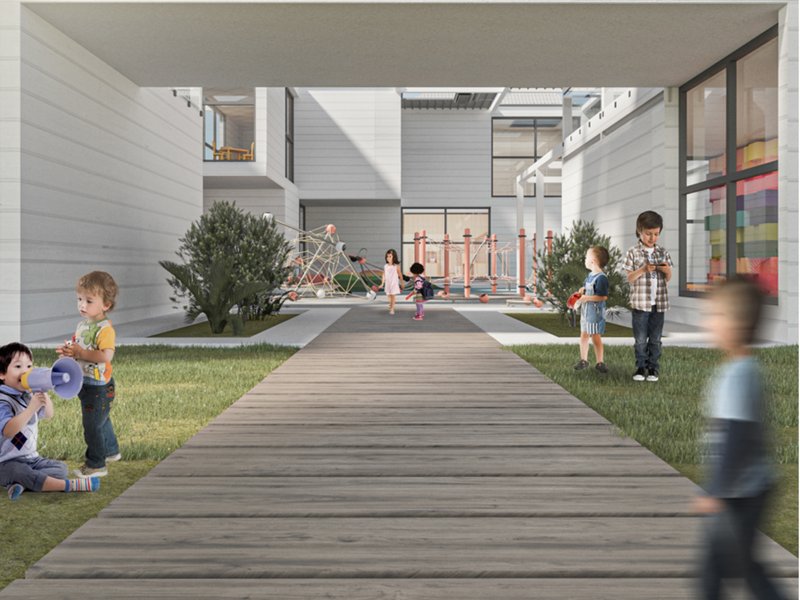 Open courtyard designed for active play and natural ventilation, surrounded by classrooms that maintain visibility and airflow.