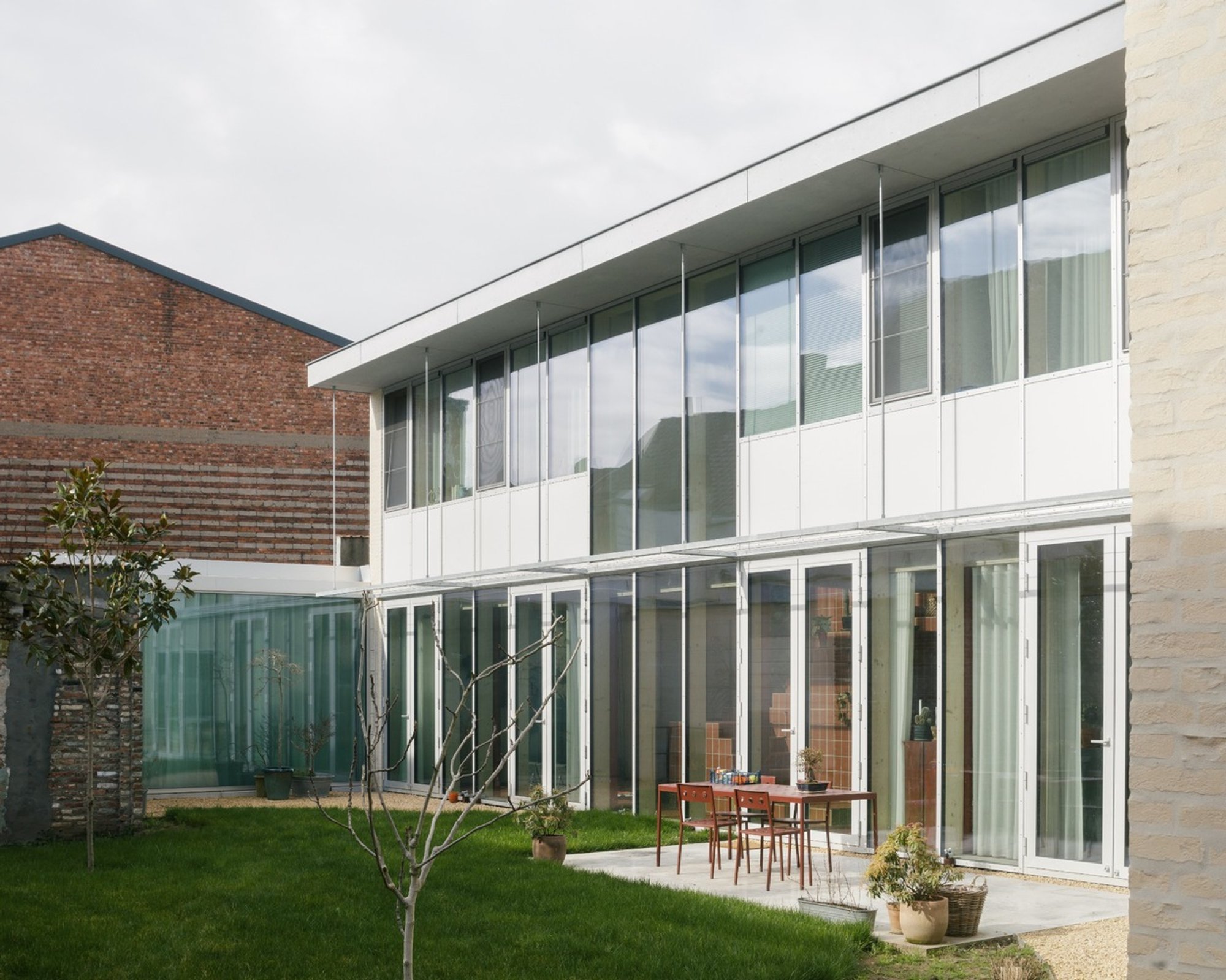 Household Practice by FELT Architecture & Design: A Harmonious Mixed-Use Urban Retreat in Ghent