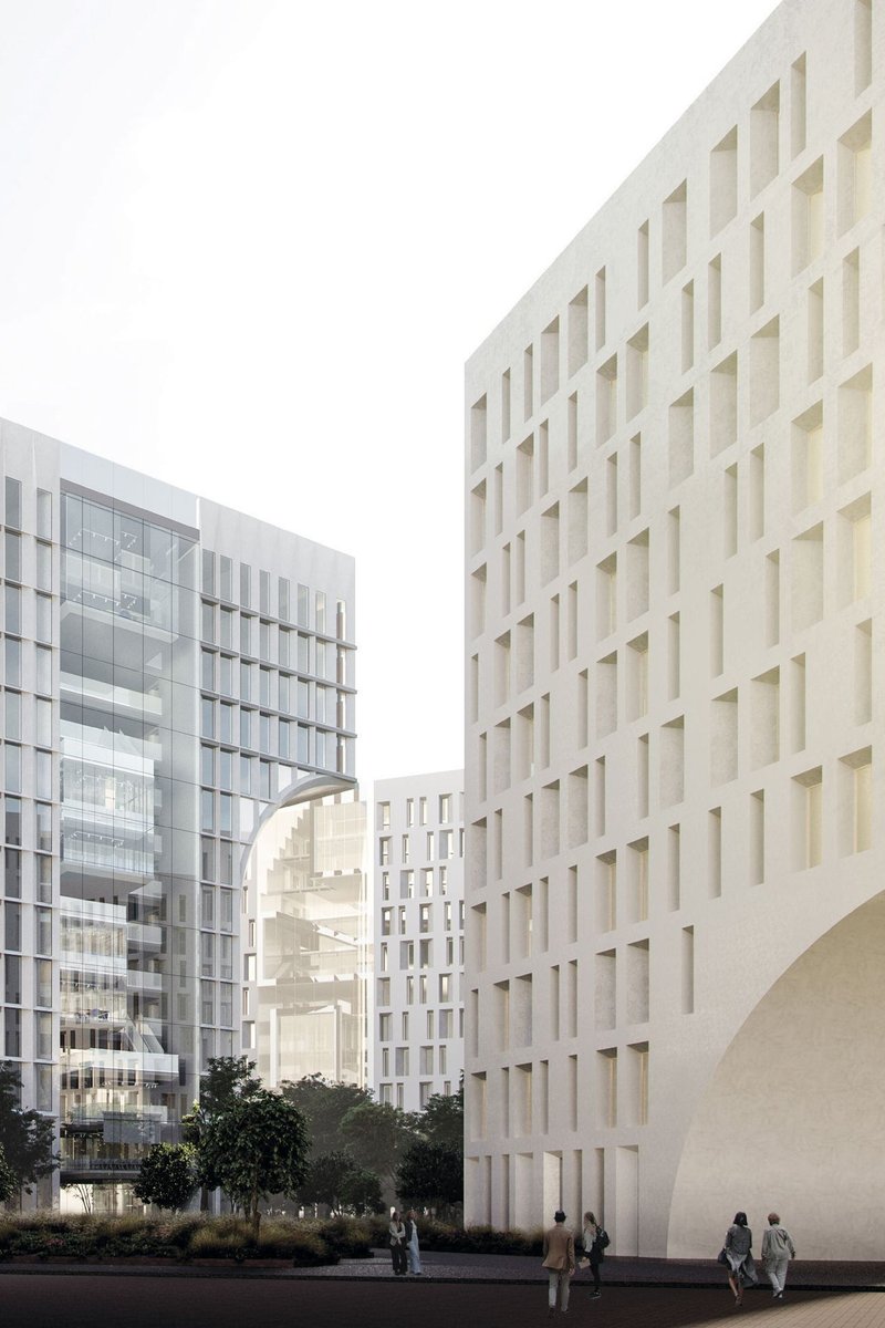 “Framed urban passage between towers, showcasing textured façades and interconnected public pathways.”