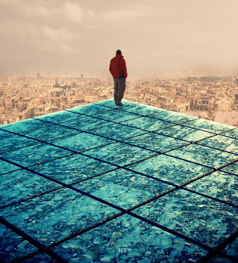 A lone figure stands above Aleppo’s ruins, overlooking a city ready to rebuild its future.
