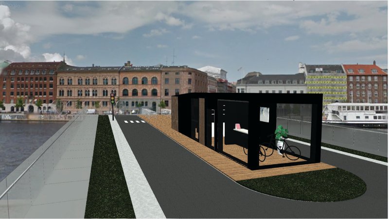 The modular café structure blends with Copenhagen’s historic waterfront skyline.